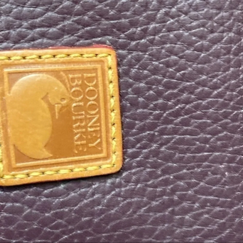 Dooney & Bourke purple and brown leather cosmetic bag